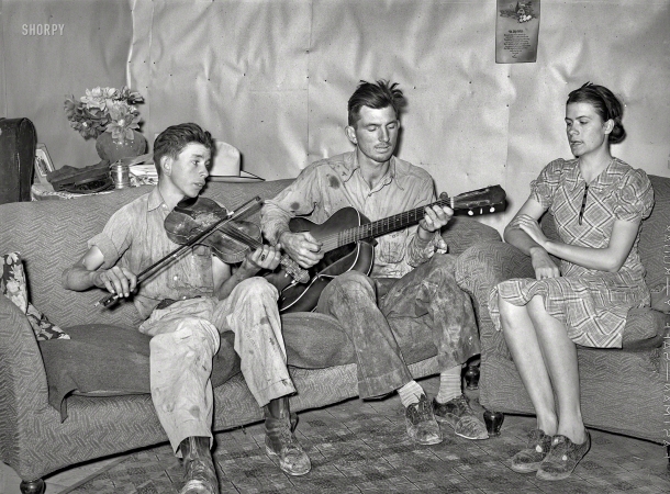 Photo showing: Grunge Band -- June 1940. Farmer, his wife, and brother in close harmony. Pie Town, New Mexico.