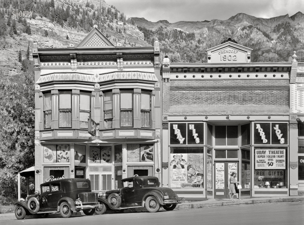 Photo showing: Too Many Husbands -- September 1940. Store building and movie theater in Ouray, Colorado.