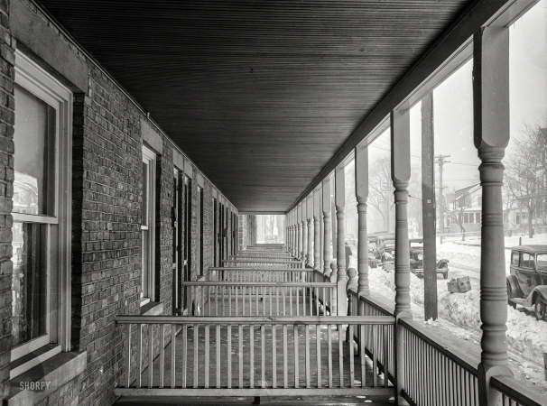 Photo showing: Infinity Porch -- February 1936. Back porches of a series of identical houses in Bound Brook, New Jersey.