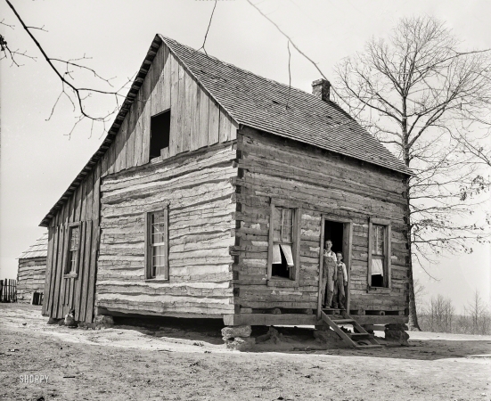 Photo showing: Cabin Boys -- March 1936. One-room house on Coalins Forest and Game Reservation between the Tennessee and Cumberland rivers in Kentucky.