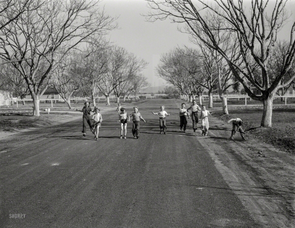 Photo showing: Jolly Street -- February 1936. Children at the El Monte subsistence homesteads, California.