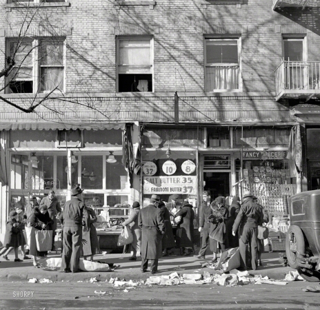 Photo showing: Fancy Groceries -- December 1936. Scene along Bathgate Avenue in the Bronx, a section
from which many of the New Jersey homesteaders have come.