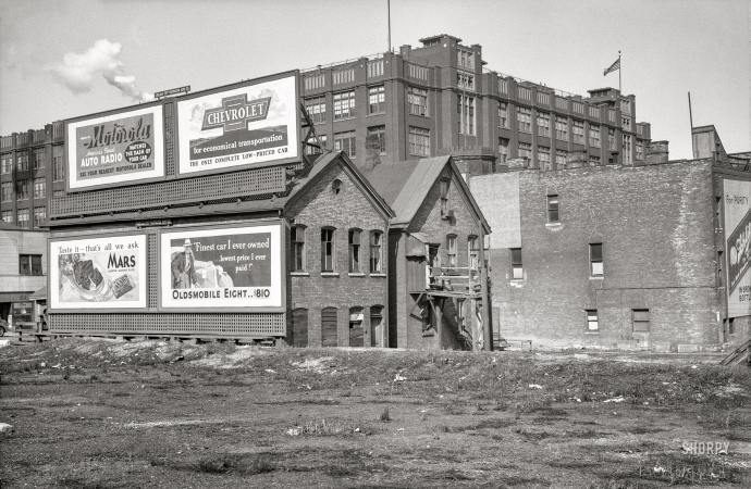 Photo showing: Cream City -- April 1936. Rear of houses at 711 West State Street. Milwaukee Vocational School in background.