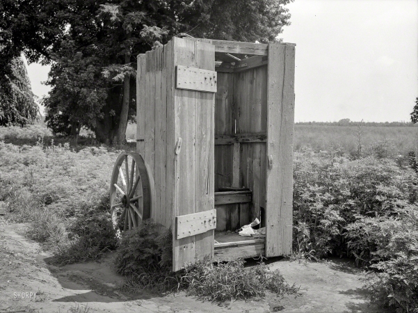 Photo showing: Porta-Privy -- August 1938. Privy on wheels for use of field workers at the King Farm near Morrisville, Pennsylvania.