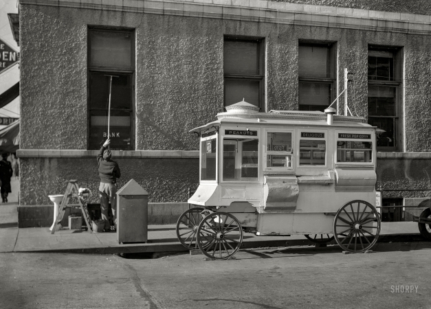 Photo showing: Jolly Time -- November 1936. Street scene. Popcorn stand in Ames, Iowa.