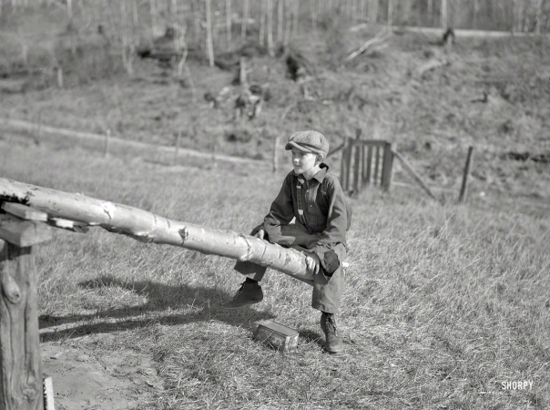 Photo showing: Teeter Tot -- May 1937. One of Max Sparks' children playing on homemade teeter-totter near Long Lake, Wisconsin.