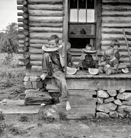 Photo showing: Melon Munchkins -- July 1939. Person County, North Carolina. Millworker's house six miles north of Roxboro.