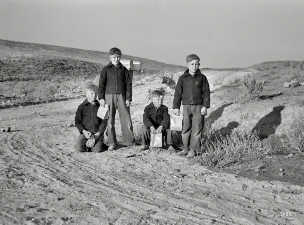 Photo showing: Four of a Kind -- October 1939. Boys from Dead Ox Flat waiting for the school bus in the morning. Malheur County, Oregon.