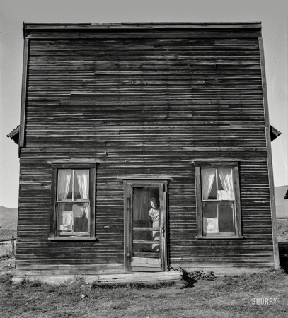 Photo showing: Jackknife Saloon -- October 1939. Gem County, Idaho. Member of Ola self help sawmill co-op lives in what was once the 'Jackknife Saloon'.