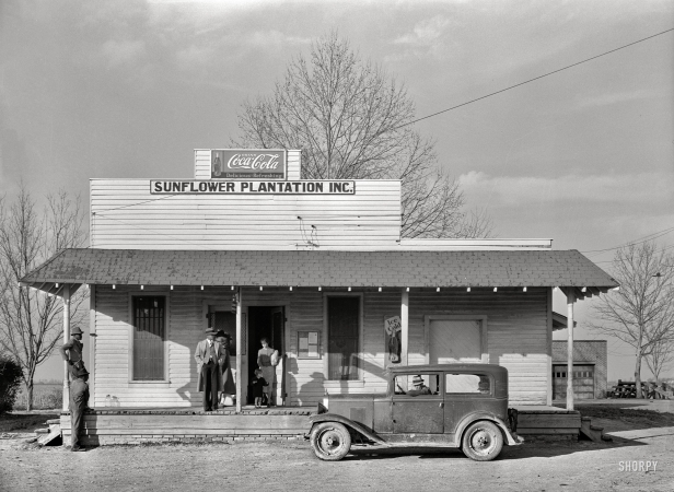 Photo showing: Sunflower Plantation -- January 1939. Headquarters and general store of Sunflower Plantation, near Merigold, Mississippi.