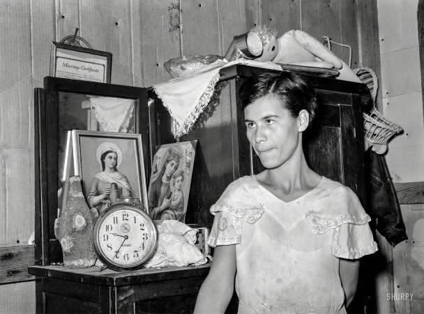 Photo showing: Marriage Bureau -- March 1939. Mexican woman standing in front of bureau. San Antonio, Texas.