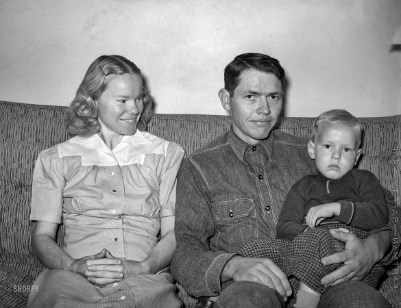 Photo showing: The Three Degrees -- May 1940. Member of the Arizona part-time farms with his wife and child. Maricopa County, Arizona. Chandler Unit.