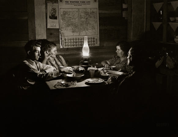 Photo showing: Pie Town Parley -- October 1940. Farm family after evening meal. Pie Town, New Mexico.