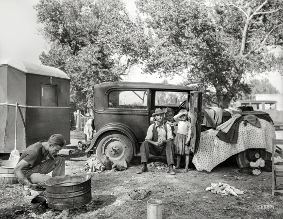 Photo showing: Just Add Water - -- November 1936. Drought refugees in migrant auto camp, California.