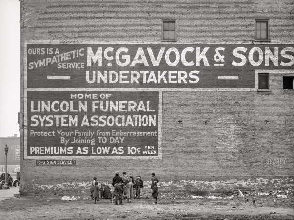 Photo showing: McGavock and Sons -- April 1941. Sign. Chicago, Illinois. (Children in the 'Black Belt,' Negro section on the South Side.)