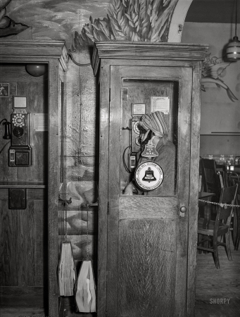 Photo showing: Buy a Slug -- April 1941. South Side Chicago. Telephone booth in Negro tavern.