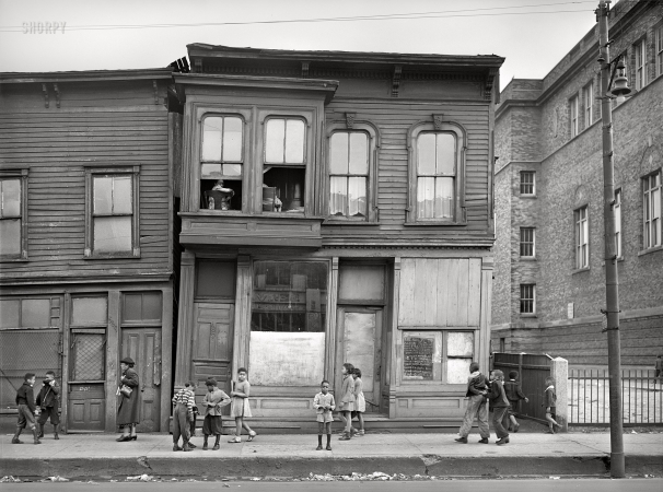 Photo showing: A Little Crooked House -- April 1941. House and children in Negro section (South Side) of Chicago, Illinois.