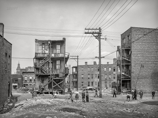 Photo showing: Playscape -- April 1941. Chicago, Illinois. Housing available to Negroes on the South Side. Children playing in vacant lot.