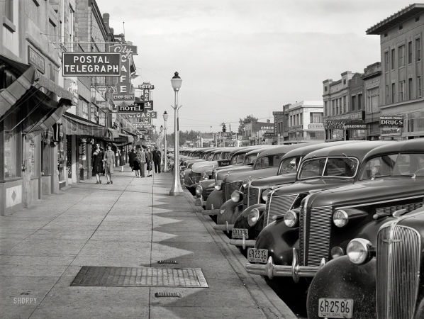 Photo showing: Twin Falls -- May 1941. Main street of Twin Falls, Idaho, shipping center for potatoes and onions.