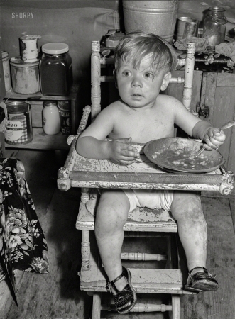 Photo showing: Check, Please -- May 1941. Child at FSA migratory labor camp mobile unit. Wilder, Idaho.