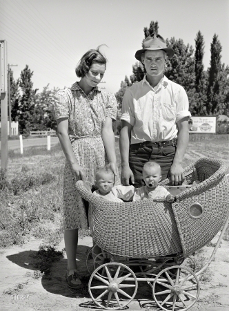 Photo showing: Rural Pacification -- May 1941. Farm worker with his wife and their twin babies at the FSA  migratory labor camp mobile unit. Wilder, Idaho.