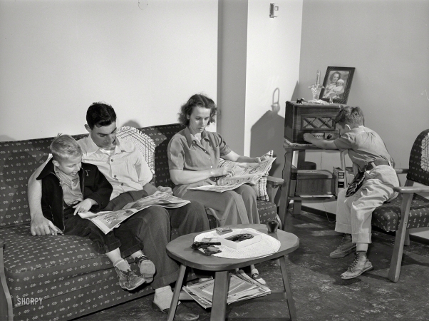 Photo showing: En Famille -- June 1941. Family of Marine in living room of Navy defense housing project. San Diego, California.