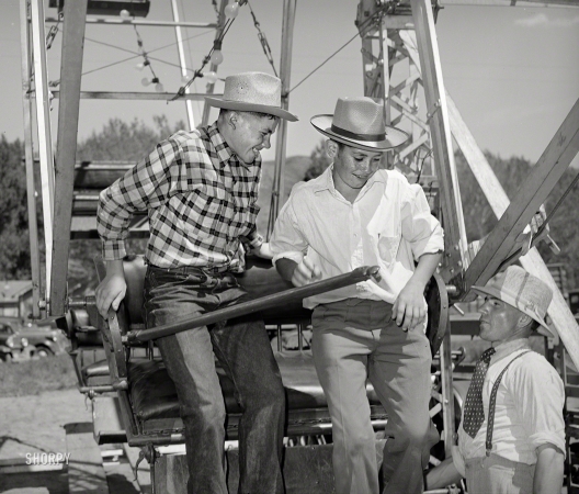 Photo showing: Joyride -- July 1941. Farm boys getting on the ferris wheel at the Fourth of July celebration in Vale, Oregon.