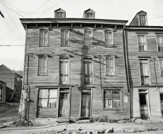 Photo showing: A Crooked House -- 1938. Shenandoah, Pennsylvania. House fronts in a mining town.