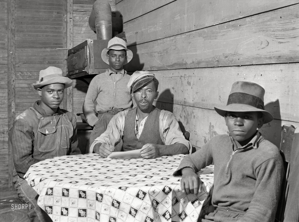 Photo showing: Character Study. -- May 1940. Farm Security Administration client Roger Spence and two of his sons. Two miles out of Princess Anne, Maryland.