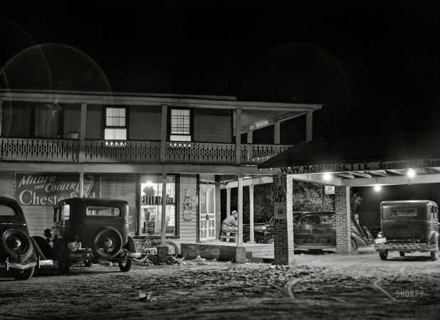 Photo showing: North by Night -- July 1940. The company store at Camden, North Carolina,
where northbound migrants buy anything from clothing to Coca-Colas.