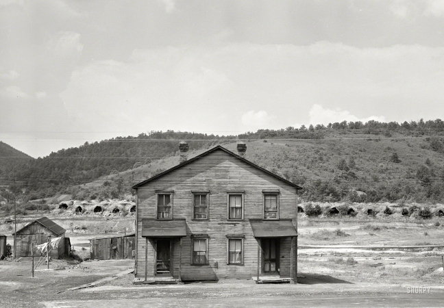 Photo showing: The Hills Have Holes -- September 1940. House in near-deserted town of Tyler, Pennsylvania, showing abandoned coke ovens in background.