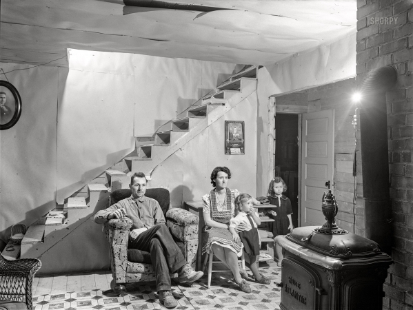 Photo showing: Meet the Labbes -- October 1940. Mr. and Mrs. Lindore Labbe and children in their newly-built home.
Mr. Labbe, FSA client, runs a small seed foundation unit in Wallagrass, Maine.