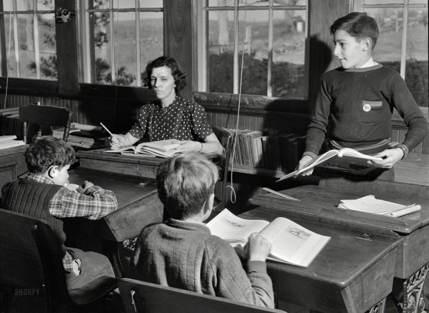 Photo showing: Class Struggle -- November 1940. In a one-room schoolhouse in Ledyard, Connecticut. The teacher is Miss Holmes.