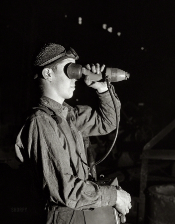 Photo showing: Ready Player 1 -- November 1940. Ansonia, Connecticut. Taking a temperature reading in the foundry at the Farrell-Birmingham Corp.