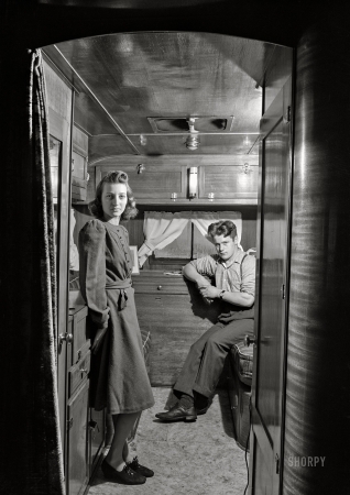 Photo showing: Early Boomers -- December 1940. War boom in a New England industrial town.
Mr. and Mrs. Leslie Bryant in their trailer about two miles out of Bath, Maine.