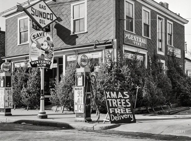 Photo showing: Nu-Blue Xmas -- December 1940. Christmas trees for sale at a gas station. Woonsocket, Rhode Island.
