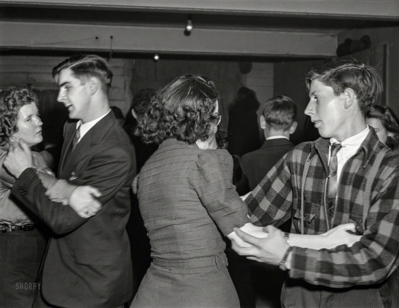 Photo showing: Swing Your Partner. -- December 1940. At a Saturday night square dance in Clayville, Rhode Island.