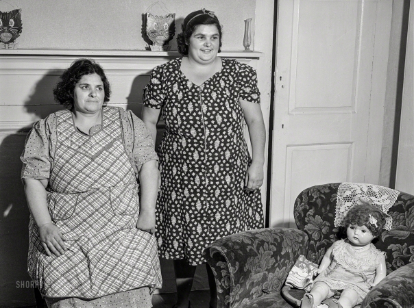 Photo showing: Cats and Dolls -- December 1940. Portsmouth, Rhode Island. Mrs. Botello and her sister, Portuguese FSA clients.