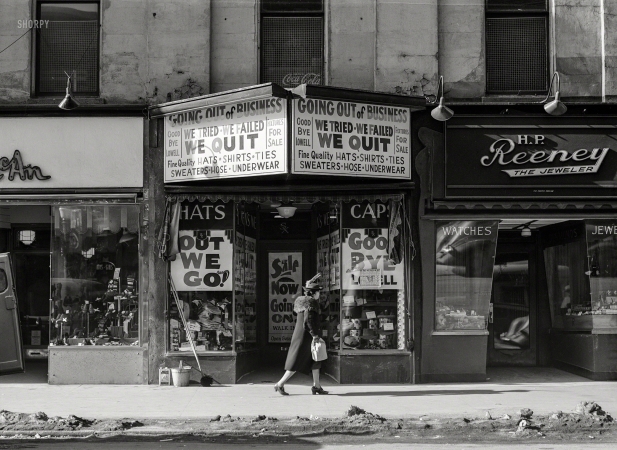 Photo showing: Out We Go! -- January 1941. Store going out of business. Lowell, Massachusetts.