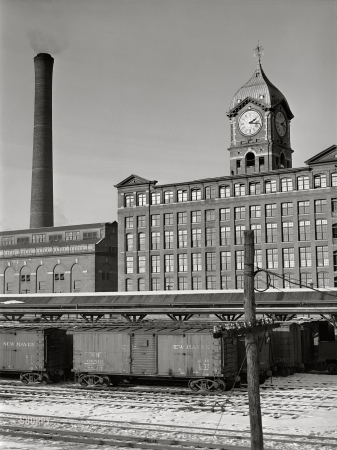 Photo showing: Factory Time -- January 1941. Railroad cars and factory buildings in Lawrence, Massachusetts.
