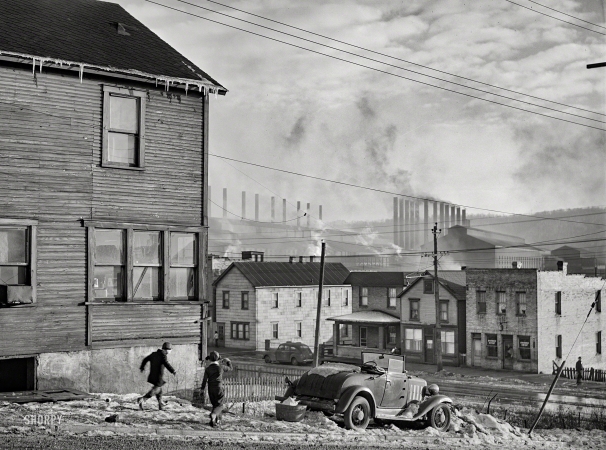 Photo showing: Boys of Steel -- January 1941. Houses and Pittsburgh Crucible Steel Company in Midland, Pennsylvania.