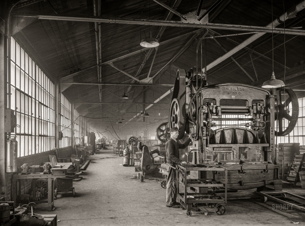 Photo showing: Tin Man II -- January 1941. Punch press at the Washington Tinplate Works. Washington, Pennsylvania.