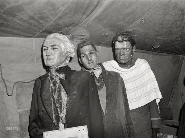 Photo showing: Unlikely Suspects -- March 1941. Effigies of George Washington, Joe Louis and some criminal in a traveling sideshow.