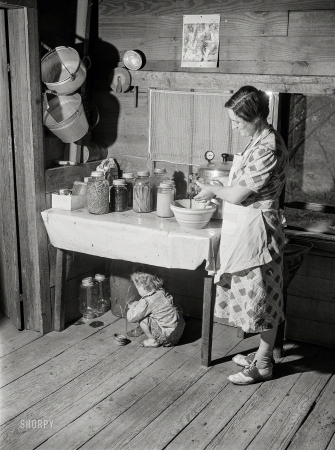 Photo showing: Mamas Kitchen -- April 1941. Mrs. Lemuel Smith still has some canned goods left over from the winter. Carroll County, Georgia.