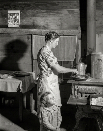 Photo showing: Atlanta Empress -- April 1941. Mrs. Lemuel Smith preparing the afternoon meal on her farm in Carroll County, Georgia.