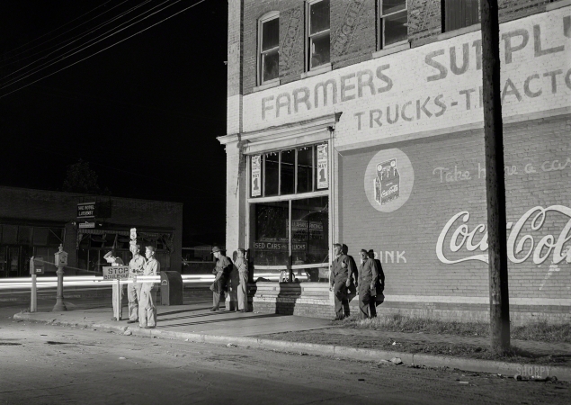Photo showing: Night Maneuvers. -- May 1941. Soldiers from a nearby Army camp waiting for the bus in Anniston, Alabama.