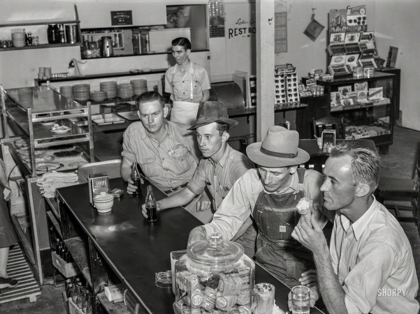 Photo showing: Coke Break -- May 1941. Workmen from the nearby Dupont powder plant in a cafe in Childersburg, Alabama.