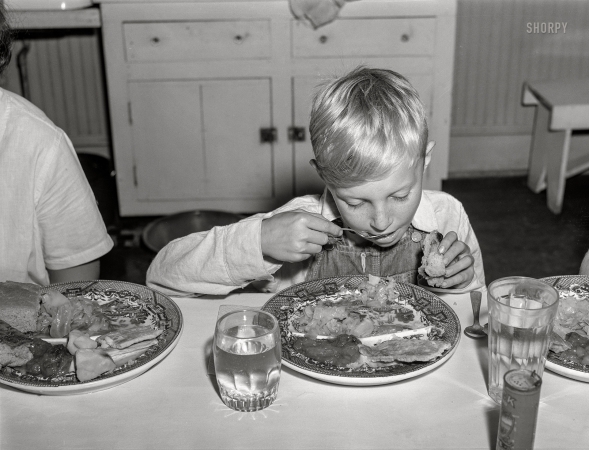 Photo showing: Five Cents Worth -- June 1941. Eating a five-cent hot lunch at the Woodville public school. Greene County, Georgia.