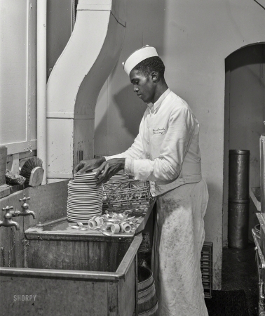 Photo showing: Drugstore Dishes -- July 1941. Negro dishwasher. Investment Pharmacy, Washington, D.C.