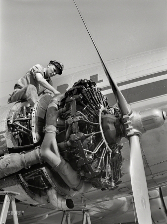 Photo showing: Sky Chief -- July 1941. Working on an engine of one of the airliners. Municipal airport, Washington, D.C.